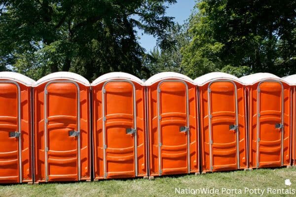 a lineup of clean and well-maintained portable loos for workers in Little Compton, RI